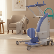 Mobility aid device in a home setting with a chair and lamp in the background.
